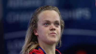 a female tennis player is looking up at the sky