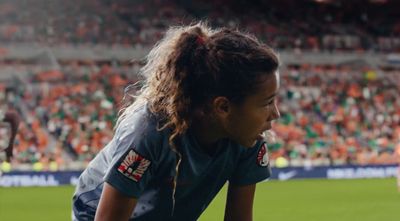 a female soccer player in action on the field