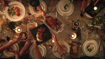 a group of people sitting around a dinner table