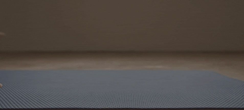 a blue mat sitting on top of a wooden floor