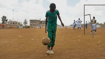 a group of young men playing a game of soccer