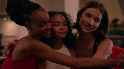 a group of young women hugging each other