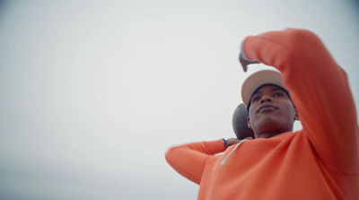 a man holding a tennis racquet on top of a tennis court