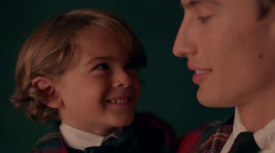 a man and a little boy wearing bow ties