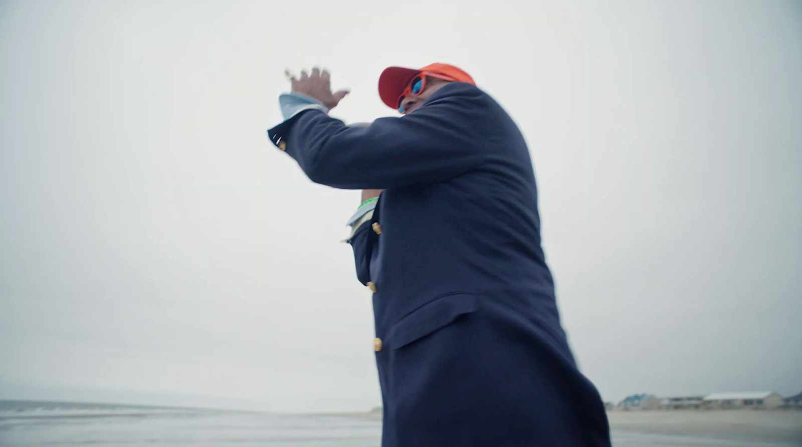 a man is flying a kite on the beach