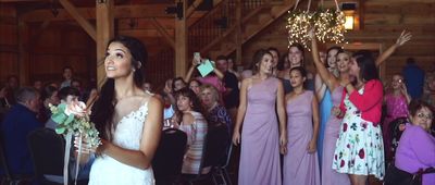 a group of women standing next to each other in front of a crowd