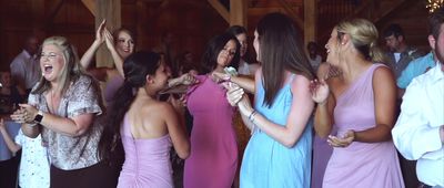 a group of women standing around each other