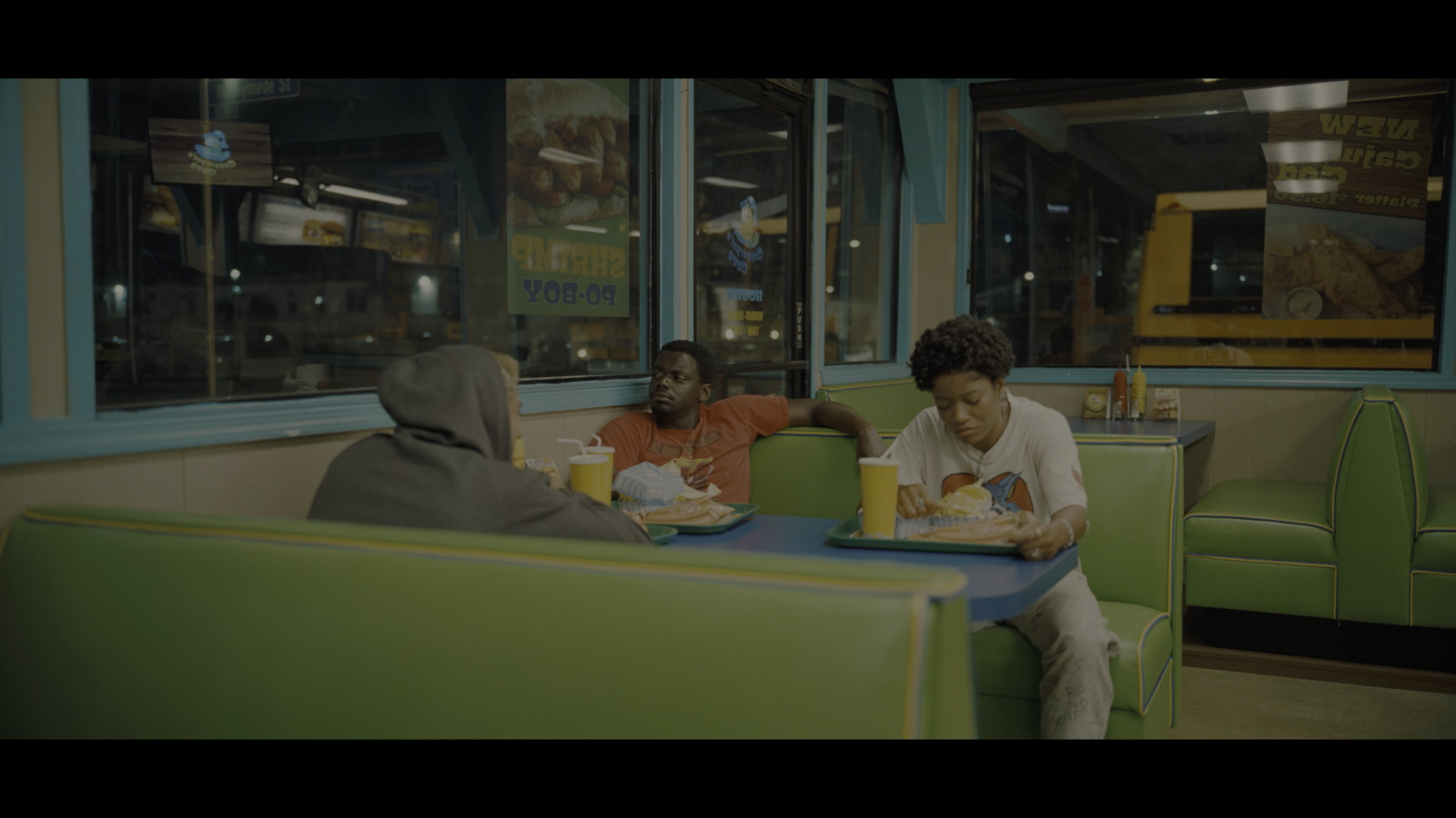  a group of people sitting at a table in a restaurant