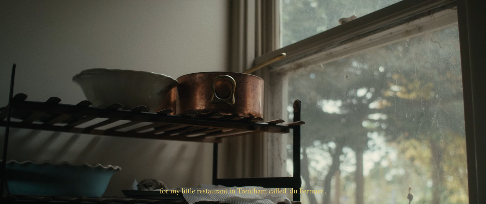 a window sill with pots and pans on it