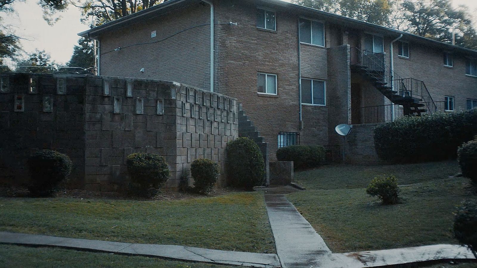 a brick building with a staircase going up the side of it