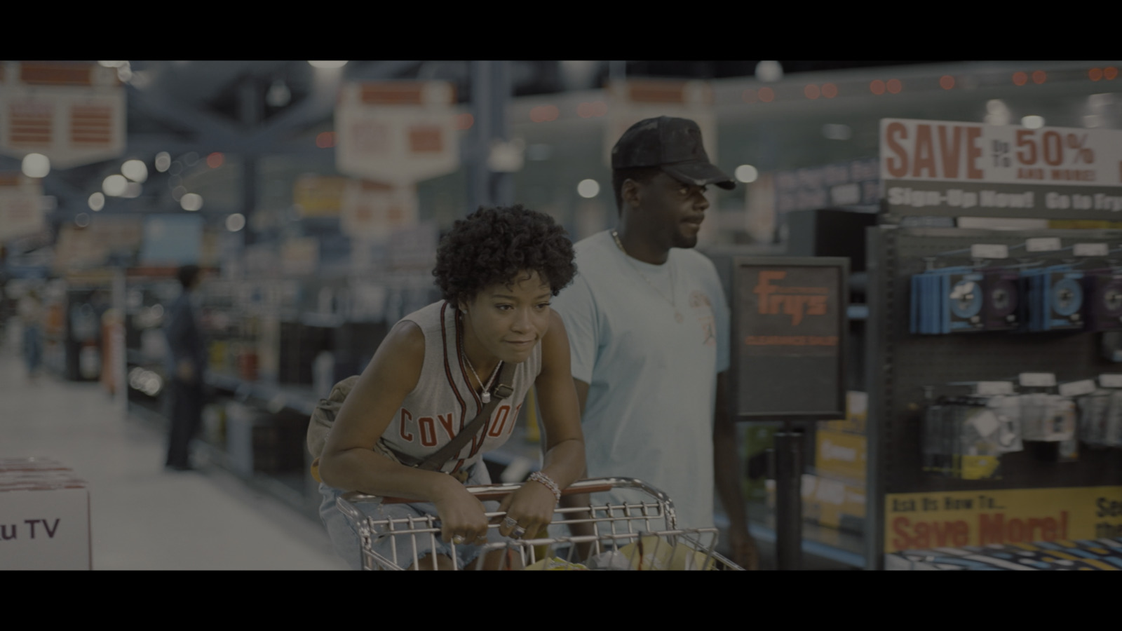 a man pushing a shopping cart in a store