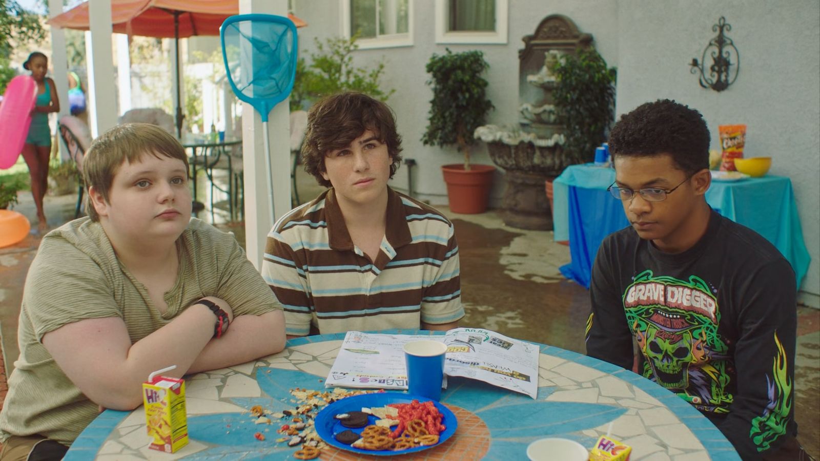 a group of young men sitting around a table