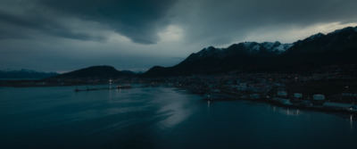 a large body of water under a cloudy sky