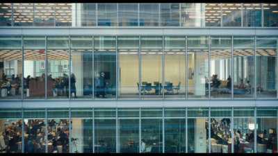 a group of people standing outside of a building