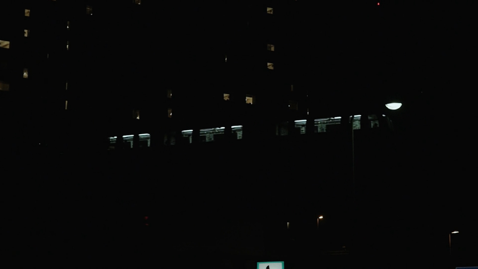 a building lit up at night with street lights