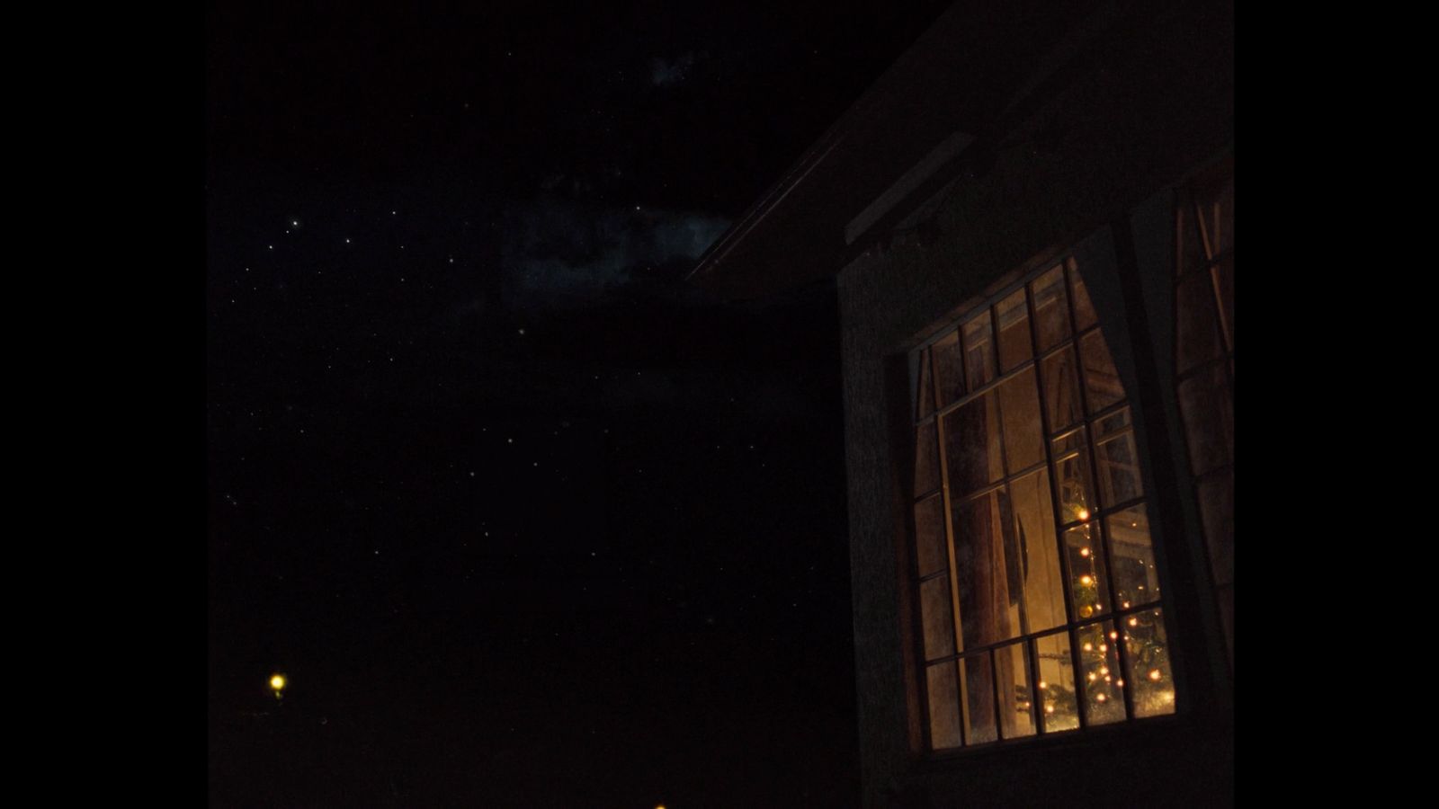 a building with a lit up window at night