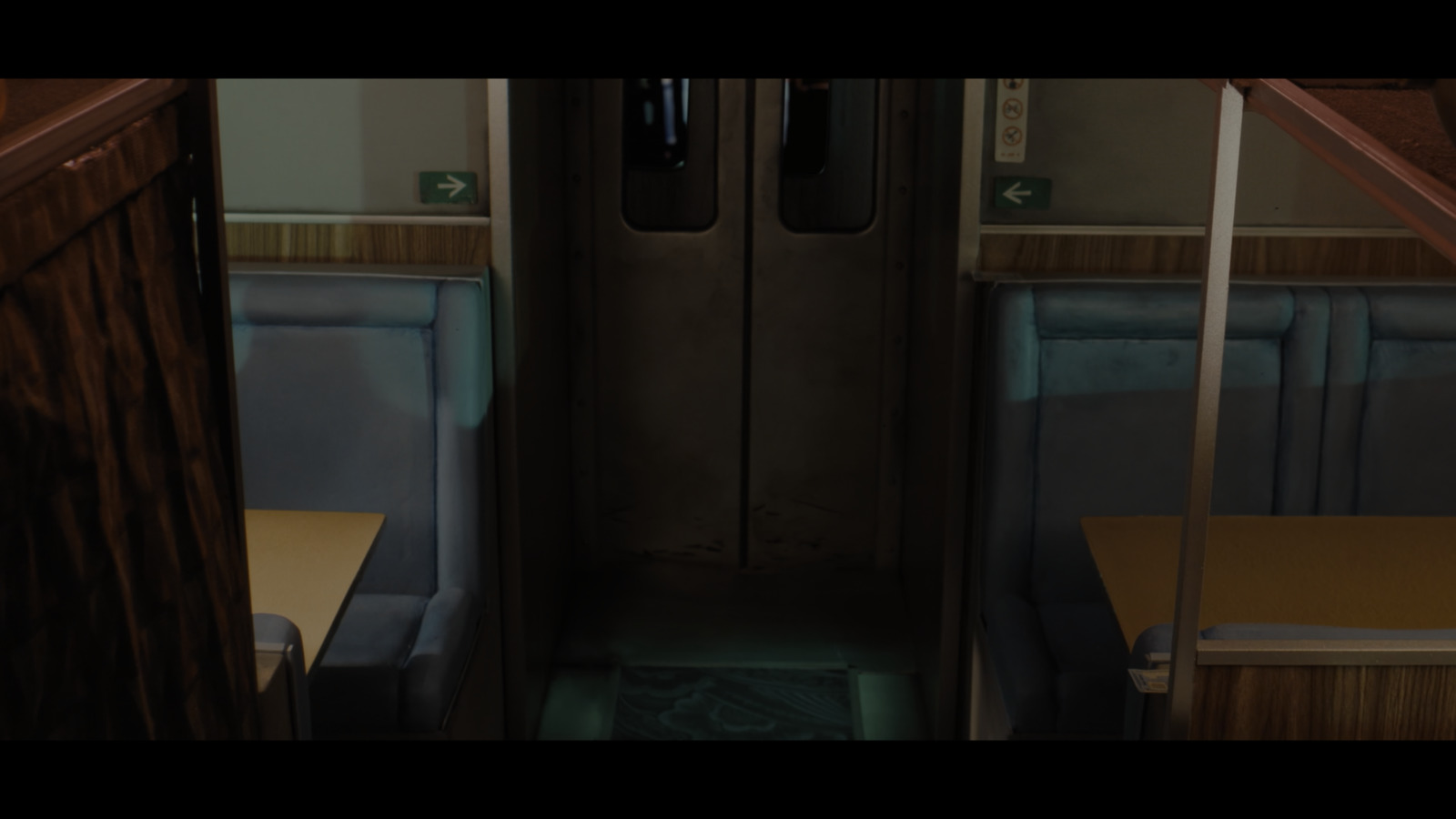 a train car with two seats and a door