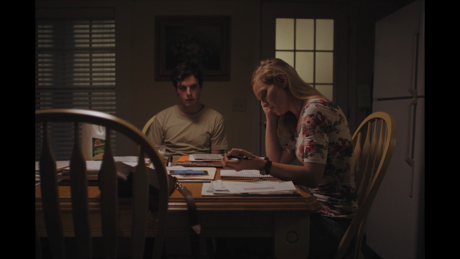 a man and a woman sitting at a table