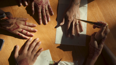 a group of people with their hands painted red