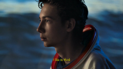 a close up of a person wearing a hoodie