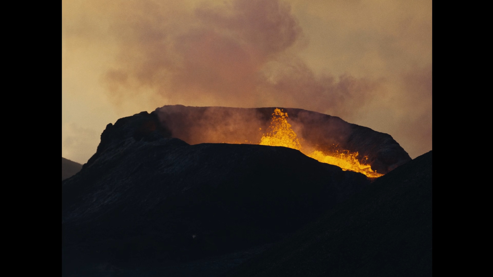 a mountain with a fire coming out of it