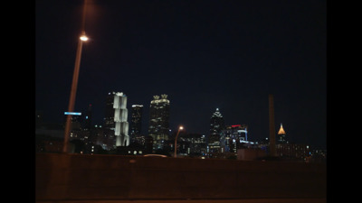 a view of a city at night from a bridge