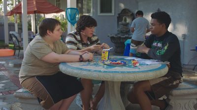 a group of people sitting around a table