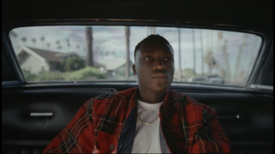 a man sitting in the back seat of a car