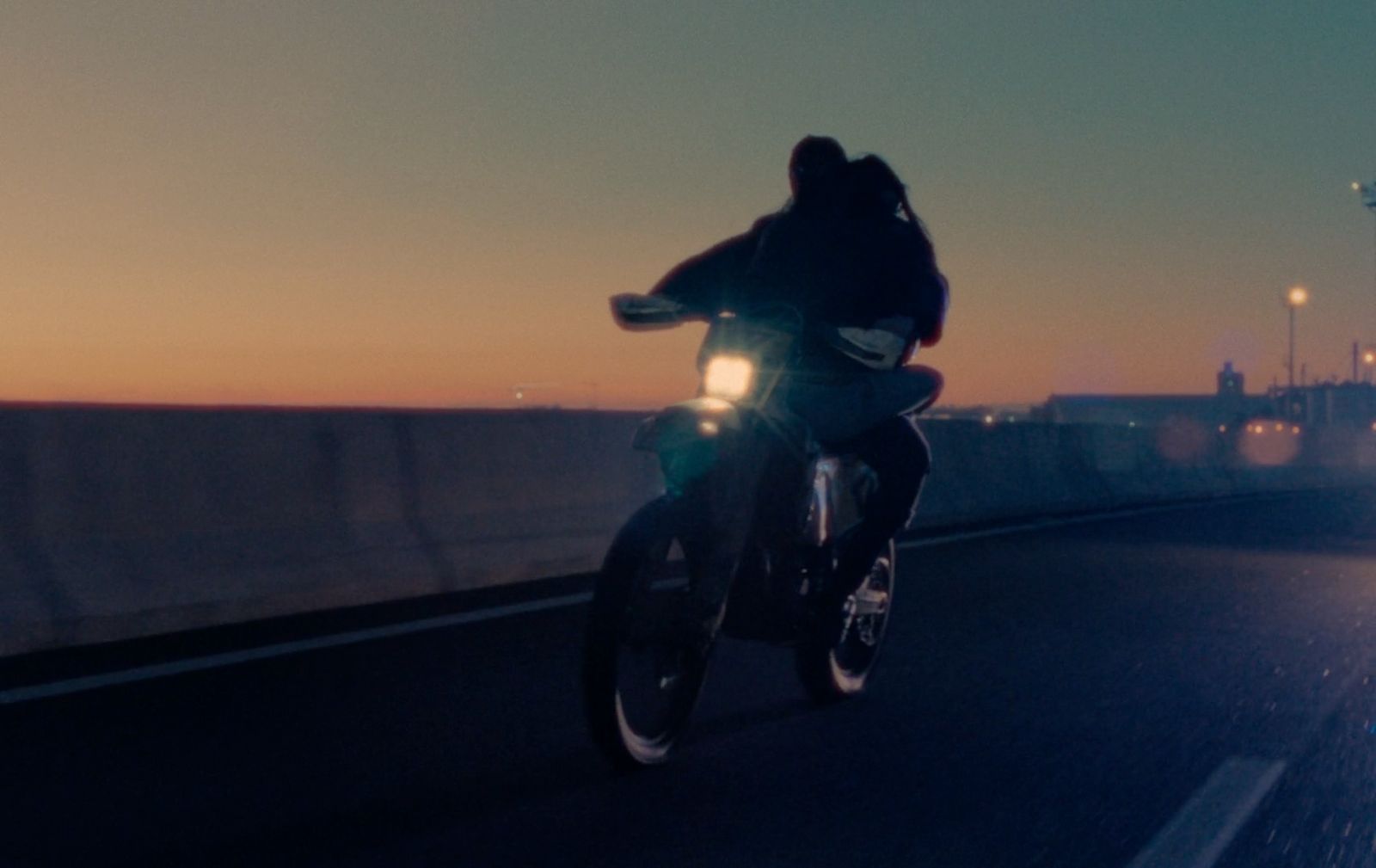 a person riding a motorcycle on a highway