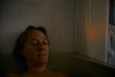 a woman that is laying down in a bath tub