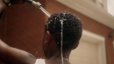 a man is spraying water on his head