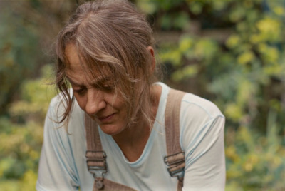 a woman holding a cell phone in her hands