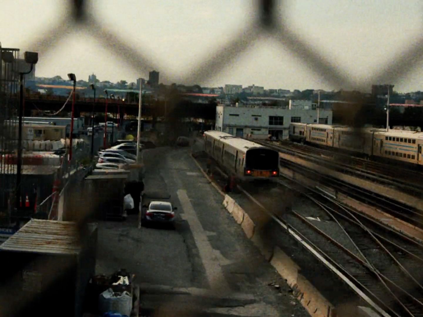 a train traveling down train tracks next to a train station