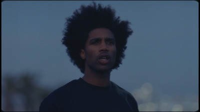 a close up of a person wearing a black shirt