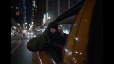 a person in a gas mask leaning out of a car window