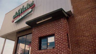 a brick building with a sign on the front of it