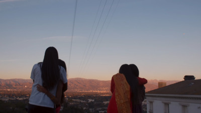 a couple of women standing next to each other