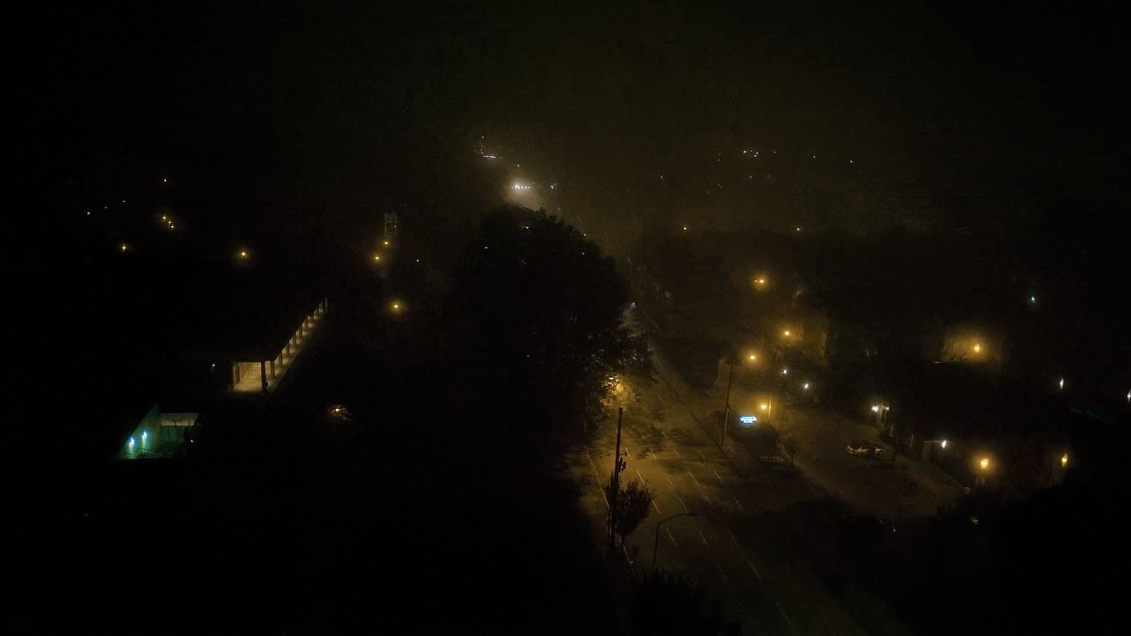 a city street at night with street lights