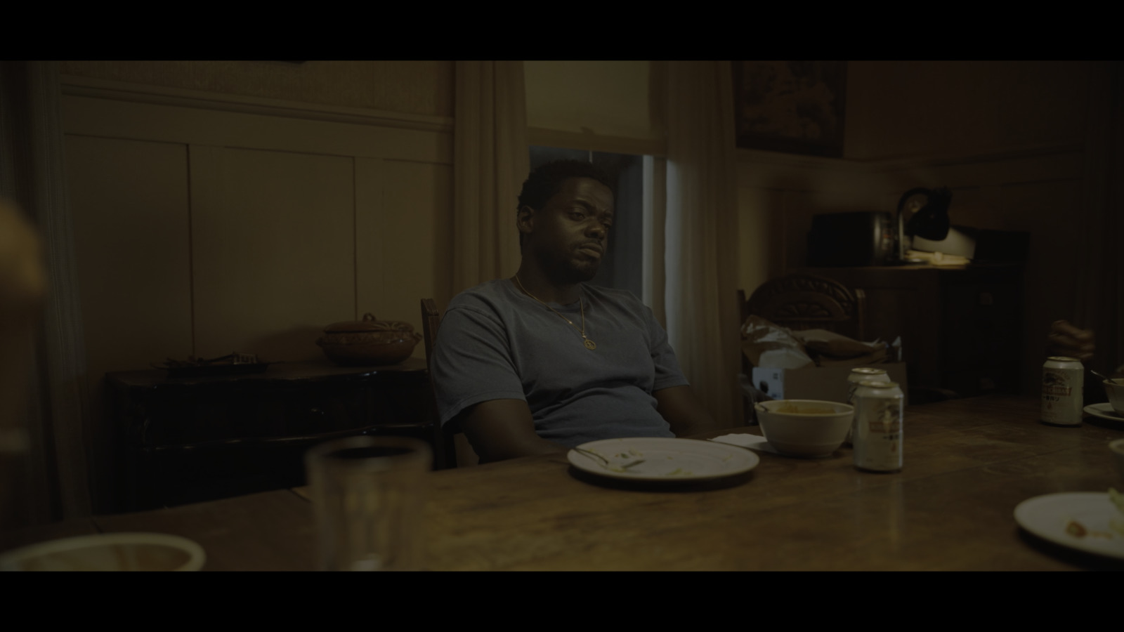 a man sitting at a table with a plate of food