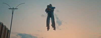 a couple of people are floating in the air