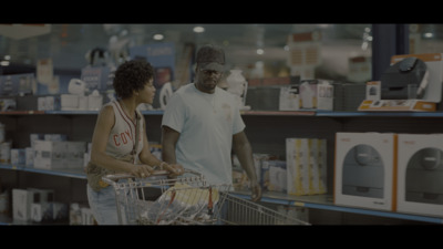 a man and a woman shopping in a store