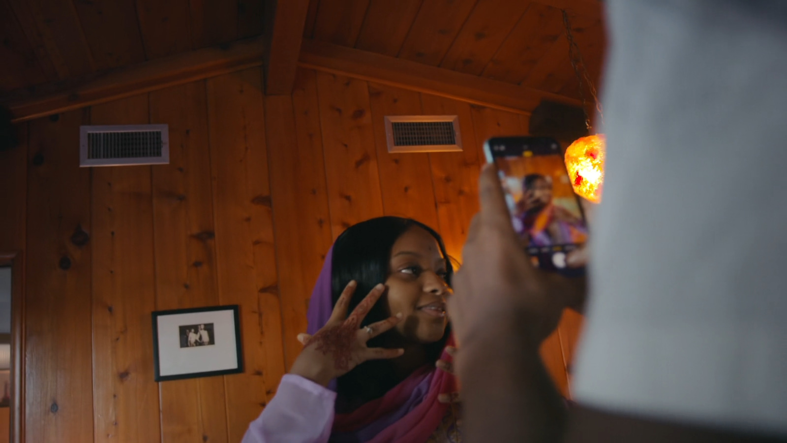 a woman taking a picture of herself in a mirror