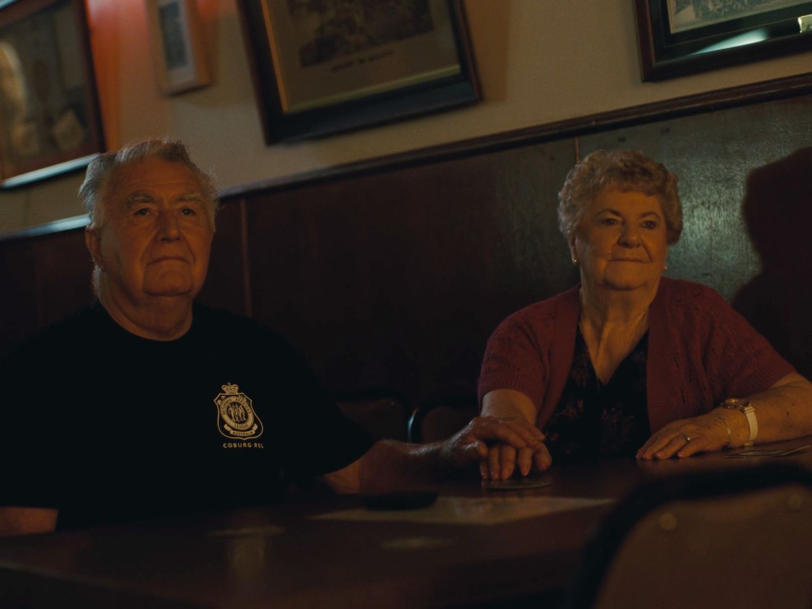 a man and a woman sitting at a table