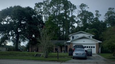 a car is parked in front of a house