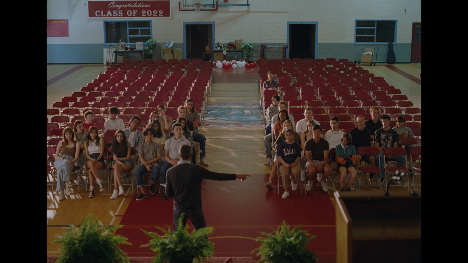 a man standing in front of a crowd of people