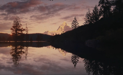 a lake with a mountain in the background