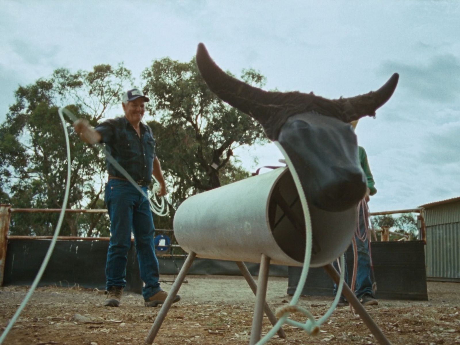 a man standing next to a bull horn