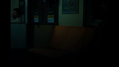 a person sitting on a bus in the dark