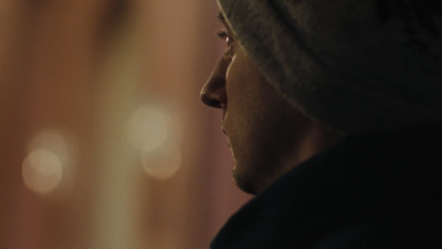 a close up of a person wearing a hat