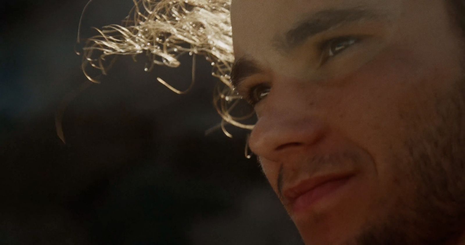 a close up of a man's face and hair